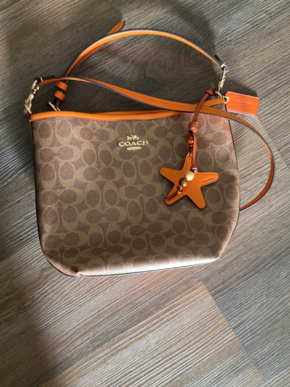 Coach Brown Signature Canvas Shoulder Bag with Orange Trim